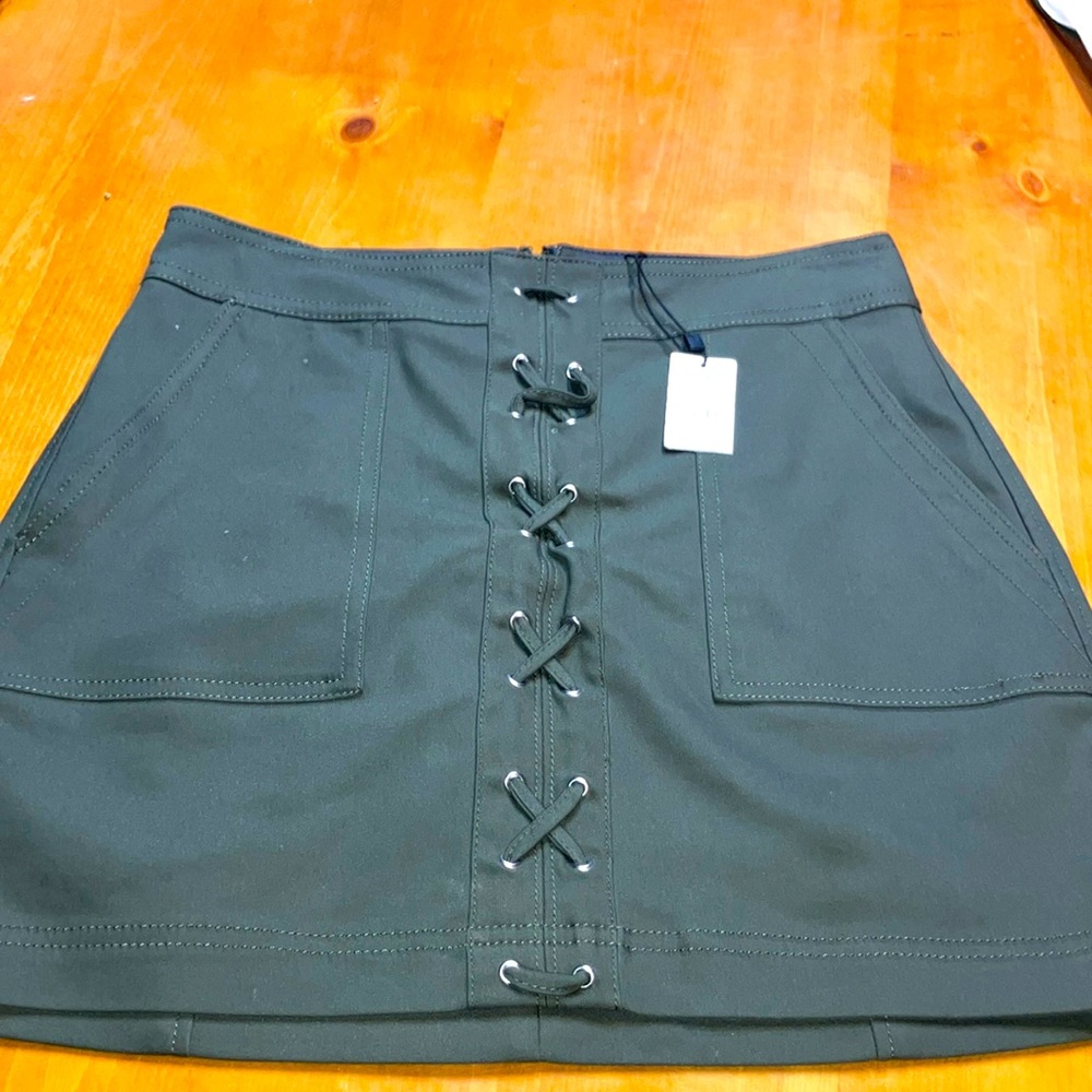Express Size 2Hunter Green Shirt.Has lace up style